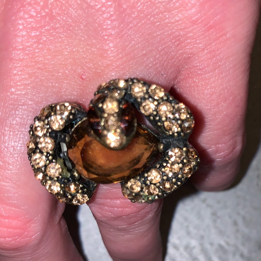 Stretchy snake ring with yellow/orange stones.